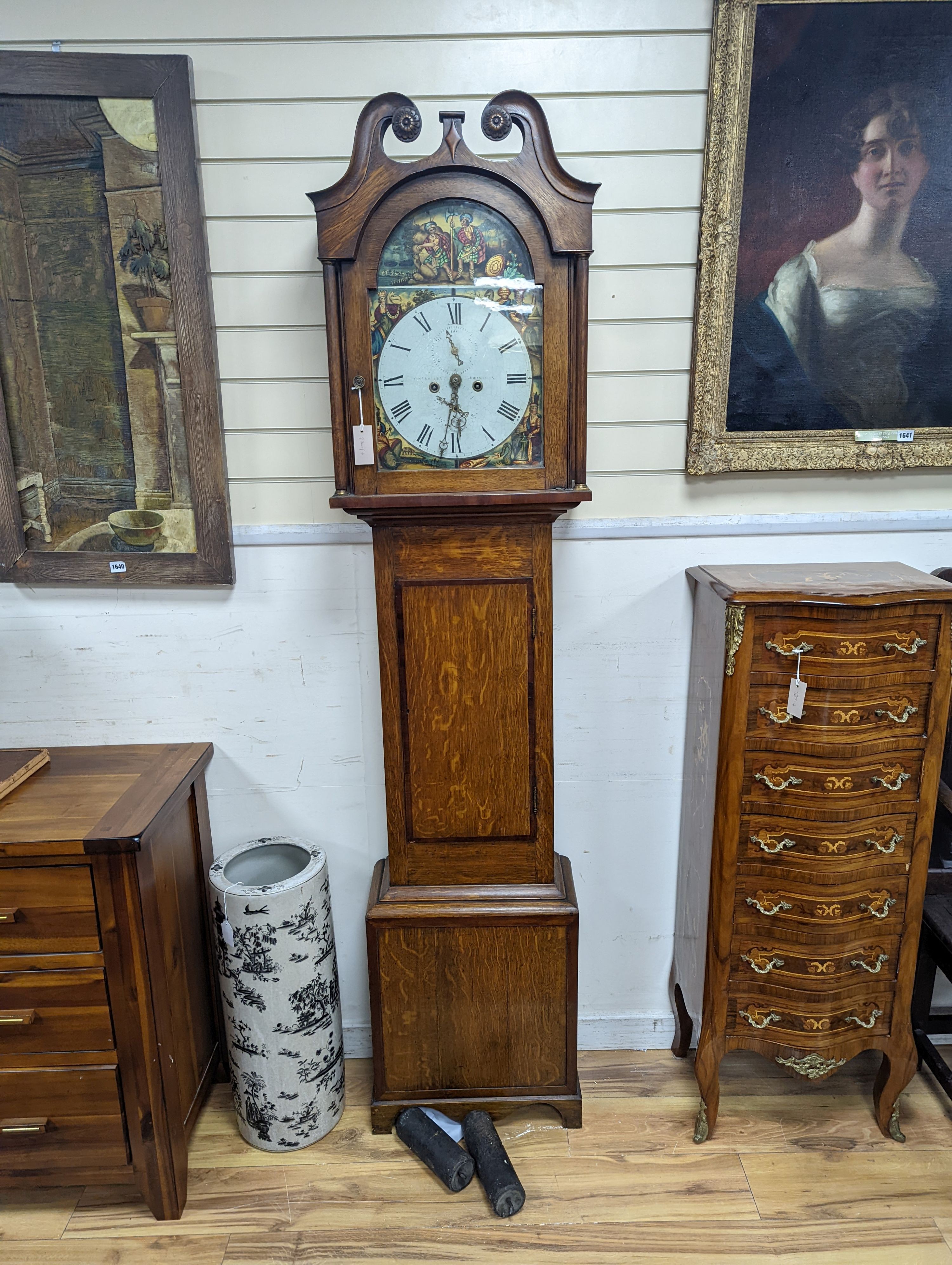 An early 19th century oak 8 day longcase clock, the dial painted with figures representing the continents, height 208cm
